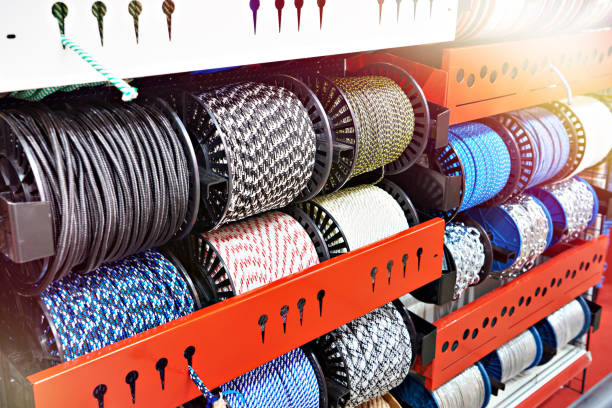 bobbins of colored rope and chains on display in store