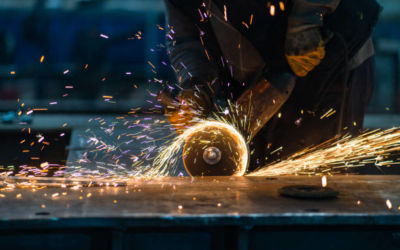 metal worker using a grinder